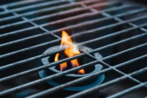 Gas grill with low flame indicating that it needs troubleshooting